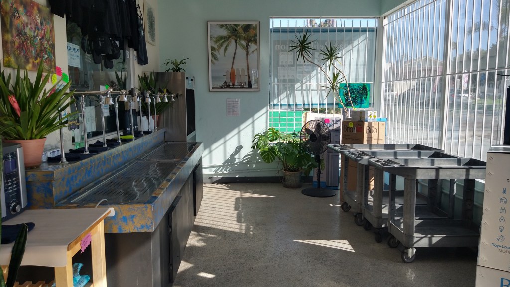 Easy self serve spigots with sanitizing station, six purified reverse osmosis spigots for water and one mineral water with magnesium and calcium. Carts for transporting bottles to the adjoining free parking lot